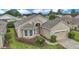 Stunning property featuring manicured landscaping, an inviting front entrance, and an attached garage creating a welcoming curb appeal at 11062 Sw 73Rd Ct, Ocala, FL 34476