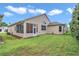 Charming home featuring a screened-in porch, well-manicured lawn, and mature landscaping offering peaceful outdoor living at 11062 Sw 73Rd Ct, Ocala, FL 34476