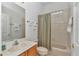 Bathroom featuring a vanity with marble countertop, tub-shower with glass block window at 11062 Sw 73Rd Ct, Ocala, FL 34476