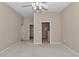 A spacious bedroom features neutral walls, carpet, and doorways that lead to a bathroom and walk-in closet at 11062 Sw 73Rd Ct, Ocala, FL 34476