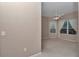 Bedroom features neutral paint, carpeting, a ceiling fan, and a large window at 11062 Sw 73Rd Ct, Ocala, FL 34476