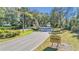 Scenic community entrance to Oak Run, framed by mature trees at 11062 Sw 73Rd Ct, Ocala, FL 34476