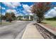 Welcoming entrance to a building featuring a well-maintained driveway and attractive landscaping at 11062 Sw 73Rd Ct, Ocala, FL 34476