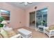 Bright enclosed lanai with tile floor and wicker furniture, perfect for relaxation at 11062 Sw 73Rd Ct, Ocala, FL 34476