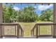 Step out onto the deck and enjoy the natural beauty of the wooded back yard at 12080 Se Sunset Harbor Rd, Weirsdale, FL 32195