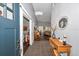Grand foyer with tall ceilings, stylish decor, and views into the open living spaces at 12080 Se Sunset Harbor Rd, Weirsdale, FL 32195