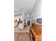 Inviting foyer with tiled floors, a grand piano, and view into the kitchen at 12080 Se Sunset Harbor Rd, Weirsdale, FL 32195