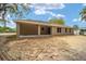The backyard has a covered patio area and a large lawn area at 12505 Sw 73Rd St, Ocala, FL 34481