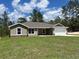 A charming single-story home with neutral paint, stone accents, and a well-manicured lawn at 12505 Sw 73Rd St, Ocala, FL 34481