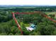 Aerial view highlighting the property's boundary surrounded by a dense forest at 12690 Ne Highway 315, Fort Mc Coy, FL 32134