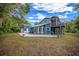 Charming two-story home with a spacious backyard, great for outdoor activities and relaxation at 12690 Ne Highway 315, Fort Mc Coy, FL 32134