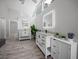 Spacious bathroom features dual sinks with granite countertops, decorative plants, and modern lighting at 12690 Ne Highway 315, Fort Mc Coy, FL 32134