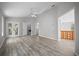 The large bedroom features wood flooring, modern lighting, and a sliding door that leads to the outside at 12690 Ne Highway 315, Fort Mc Coy, FL 32134