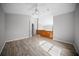 This lovely loft area features durable wood-look floors, ceiling fan, and modern wooden railing at 12690 Ne Highway 315, Fort Mc Coy, FL 32134