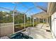 Backyard oasis with covered patio and relaxing hot tub area at 1308 La Estrellita Way, The Villages, FL 32162