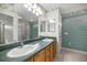 Bathroom featuring a double sink vanity, a glass enclosed shower, and tile floors at 1308 La Estrellita Way, The Villages, FL 32162
