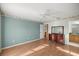 Bright bedroom features soft blue wall, ceiling fan and large dresser at 1308 La Estrellita Way, The Villages, FL 32162