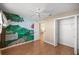 Bedroom with a unique mural, ceiling fan and closet at 1308 La Estrellita Way, The Villages, FL 32162
