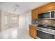 Eat-in kitchen with tile flooring and stainless steel appliances at 1308 La Estrellita Way, The Villages, FL 32162
