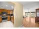Open floor plan with kitchen leading to living area at 1308 La Estrellita Way, The Villages, FL 32162