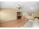 Bright living room featuring wood floors and a view into the entrance foyer at 1308 La Estrellita Way, The Villages, FL 32162