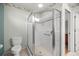 Modern bathroom featuring glass enclosed shower with tile surround and built-in niche at 1308 La Estrellita Way, The Villages, FL 32162