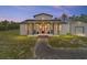 Charming home exterior with a inviting front porch and well-maintained landscaping at 13663 Sw 66Th St, Ocala, FL 34481