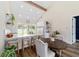 Bright eat-in kitchen with center island, quartz countertops, stainless steel appliances, and vaulted ceiling at 13663 Sw 66Th St, Ocala, FL 34481