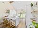 Modern, all-white kitchen with marble countertops and stainless steel appliances at 13663 Sw 66Th St, Ocala, FL 34481