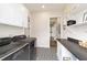Bright laundry room featuring modern appliances, ample countertop space, and storage solutions for efficient organization at 13663 Sw 66Th St, Ocala, FL 34481