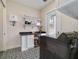 Functional laundry room with shelving, countertop, and modern appliances providing a practical space for chores at 13663 Sw 66Th St, Ocala, FL 34481