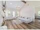 Inviting living room featuring a stone fireplace and abundant natural light at 13663 Sw 66Th St, Ocala, FL 34481
