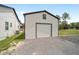 Detached outbuilding with a garage door offers versatile space for storage or hobbies at 13663 Sw 66Th St, Ocala, FL 34481