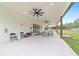 Large covered patio featuring multiple seating areas, perfect for enjoying outdoor living and entertainment in style at 13663 Sw 66Th St, Ocala, FL 34481