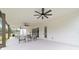 Expansive covered patio featuring multiple seating areas, ideal for outdoor gatherings and enjoying the serene surroundings at 13663 Sw 66Th St, Ocala, FL 34481