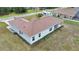 Aerial view of a home featuring a spacious yard, a light color scheme, and a covered back patio at 14550 Sw 61St Ct, Ocala, FL 34473