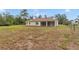 Backyard showcasing the expansive lot and covered patio at 14550 Sw 61St Ct, Ocala, FL 34473