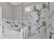 Spa-like bathroom featuring a soaking tub and a rainfall shower at 14550 Sw 61St Ct, Ocala, FL 34473