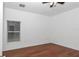 Bright bedroom with hardwood floors, ceiling fan and window with blinds at 14550 Sw 61St Ct, Ocala, FL 34473