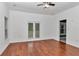 Bright bedroom with hardwood floors and sliding glass doors to the patio at 14550 Sw 61St Ct, Ocala, FL 34473