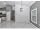 Dining room area features modern paint, lighting, and flooring with easy access to the kitchen and bedrooms at 14550 Sw 61St Ct, Ocala, FL 34473