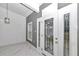 Close up of front door area featuring modern design elements including paint, flooring, and natural light at 14550 Sw 61St Ct, Ocala, FL 34473