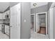 Hallway leads to a kitchen and bathroom at 14550 Sw 61St Ct, Ocala, FL 34473