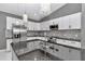 Modern kitchen with granite counters, stainless appliances, island sink at 14550 Sw 61St Ct, Ocala, FL 34473