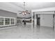 Bright living room with marble floors leads to a modern kitchen at 14550 Sw 61St Ct, Ocala, FL 34473