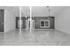 Bright living room with marble floors and stylish ceiling fan at 14550 Sw 61St Ct, Ocala, FL 34473