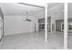 Bright living room with marble floors and ceiling fan at 14550 Sw 61St Ct, Ocala, FL 34473