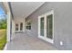 Covered patio with tile floor, offering seamless indoor-outdoor living at 14550 Sw 61St Ct, Ocala, FL 34473
