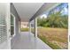 Covered patio with views of the lush backyard at 14550 Sw 61St Ct, Ocala, FL 34473