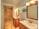 Bathroom with double vanity, shower, and modern lighting at 1610 Se 22Nd Ave, Ocala, FL 34471